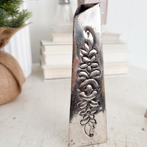 May include: A rustic wooden sign with the text "Welcome to our home" in white lettering. The sign features a distressed finish and a simple, inviting design, perfect for a front porch or entryway.