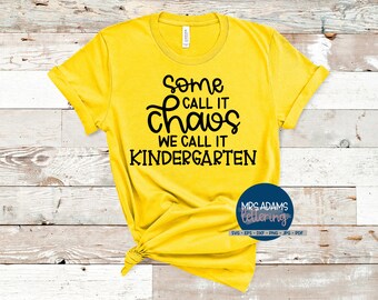 May include: Yellow t-shirt with black text that reads "Some call it chaos we call it kindergarten".