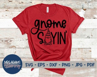 May include: Red t-shirt with a black gnome graphic and the text "gnome sayin'" in black.
