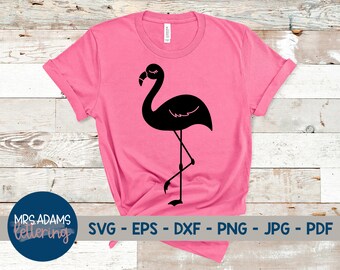 May include: A pink t-shirt with a black silhouette of a flamingo on the front. The text "SVG - EPS - DXF - PNG - JPG - PDF" is printed below the flamingo.