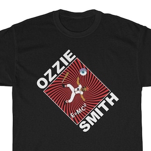 May include: Black t-shirt with a red and white graphic of a baseball player in a red and white uniform with the text "Ozzie Smith" and "E=MC2" on the graphic.