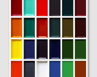 May include: A white rectangular palette filled with 24 vibrant watercolor paint colors. The colors include shades of red, orange, yellow, blue, green, and brown. Each color is in its own rectangular compartment.