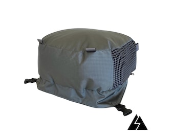 May include: A grey and black backpack with a mesh panel and adjustable straps.