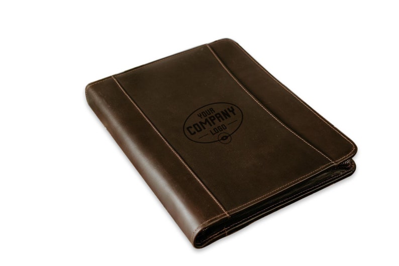 May include: A brown leather zippered binder with a stitched design and the text "YOUR COMPANY LOGO" embossed on the front.