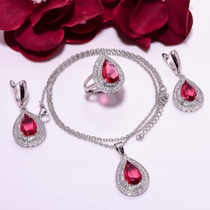 May include: A set of three ceramic mugs with a speckled, matte finish in cream, light grey, and dark grey. Each mug has a simple, minimalist design, suitable for coffee or tea.