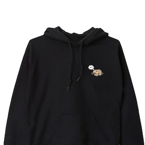 May include: Black hoodie with a small embroidered image of a sloth sleeping on a branch with a thought bubble above it.