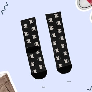 May include: A pair of black socks with a white mouse pattern. The socks are shown from the front and back. The front of the socks has the text "Front" and the back of the socks has the text "Back".