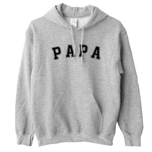 May include: A gray hooded sweatshirt with the word "PAPA" printed in black on the front.