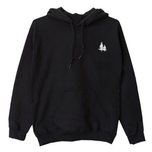 May include: Black hooded sweatshirt with a white embroidered design of two pine trees on the front.