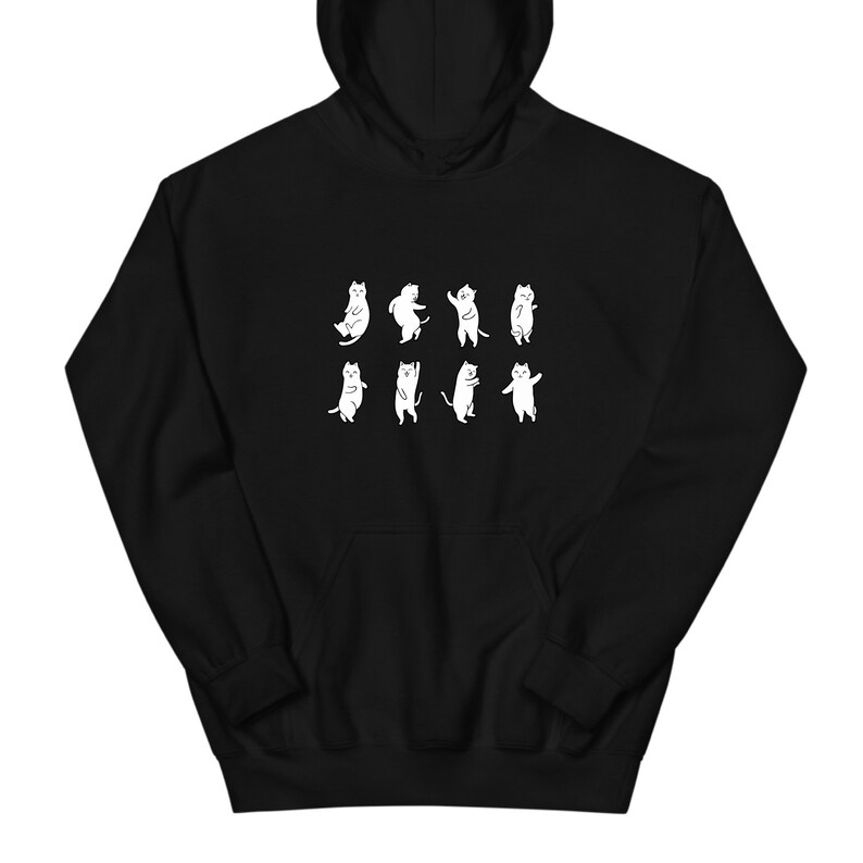 K&ouml;nnte beinhalten: Schwarzer Hoodie mit einem wei&szlig;en Aufdruck von neun tanzenden Katzen in verschiedenen Posen.