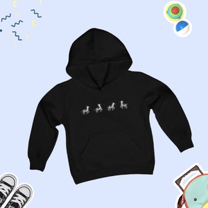 May include: Black kids' hoodie with a white graphic of four zebras walking in a line.