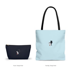 May include: A set of two bags featuring a small blue pouch and a larger blue tote bag. Both bags have a white background with a small embroidered image of a black and white puffin.