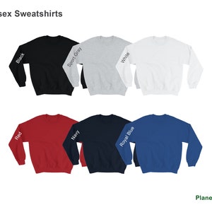 May include: A set of ten unisex sweatshirts in various colors, including black, sport gray, white, red, navy, royal blue. Each sweatshirt has a color name printed on the sleeve.