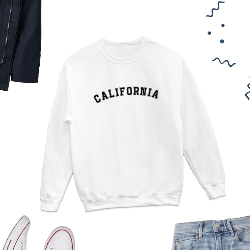 May include: White sweatshirt with black text that reads "CALIFORNIA" in an arched font.