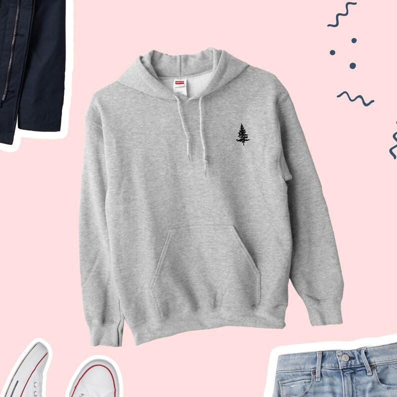 May include: A gray hooded sweatshirt with a small black tree design on the front. The sweatshirt has a kangaroo pocket and a drawstring hood.