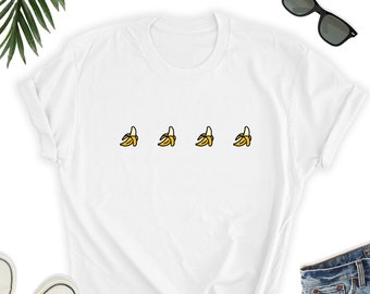 May include: White t-shirt with a graphic of three yellow bananas on the front.
