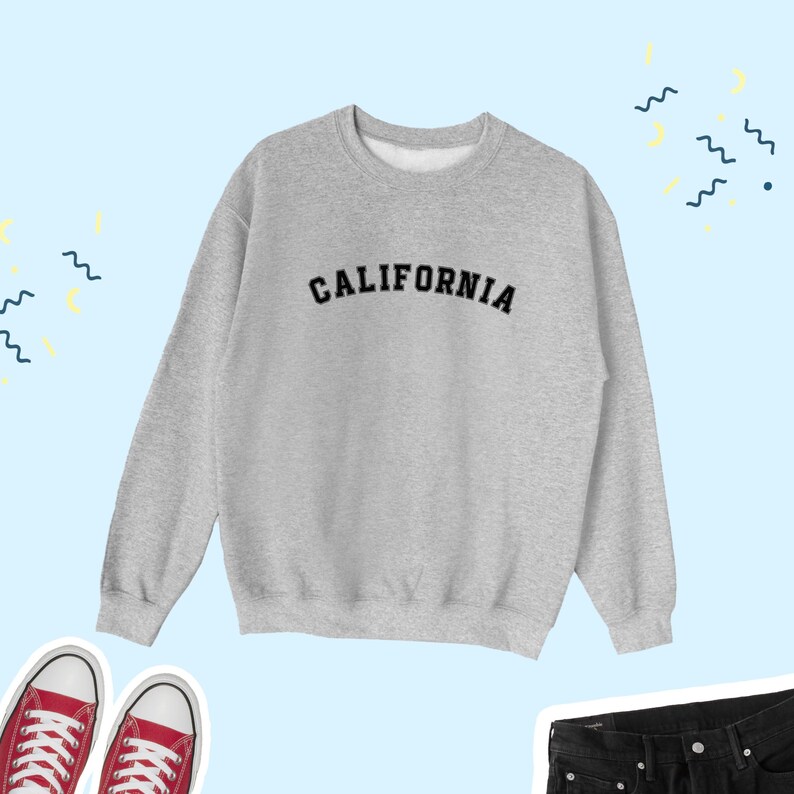 May include: A gray sweatshirt with the word "CALIFORNIA" printed in black on the front.