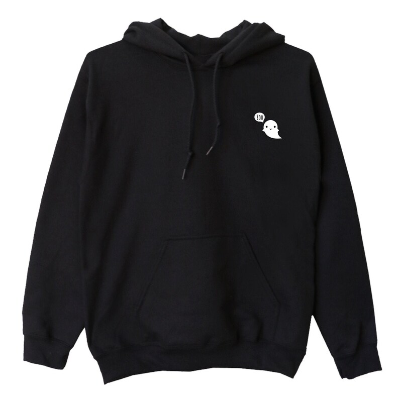May include: Black hooded sweatshirt with a front pocket and drawstring. A small white ghost graphic with the word "boo" in a speech bubble is on the upper left chest. The sweatshirt is made of a soft material.