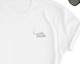 May include: White t-shirt with a small embroidered image of a gray mouse with pink ears.