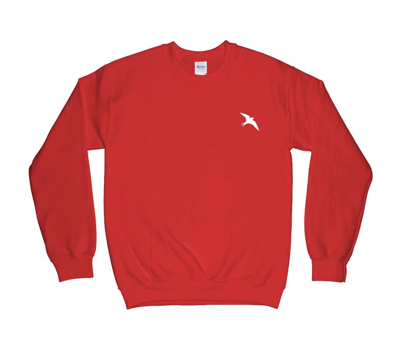 May include: Red sweatshirt with a white bird graphic on the front.