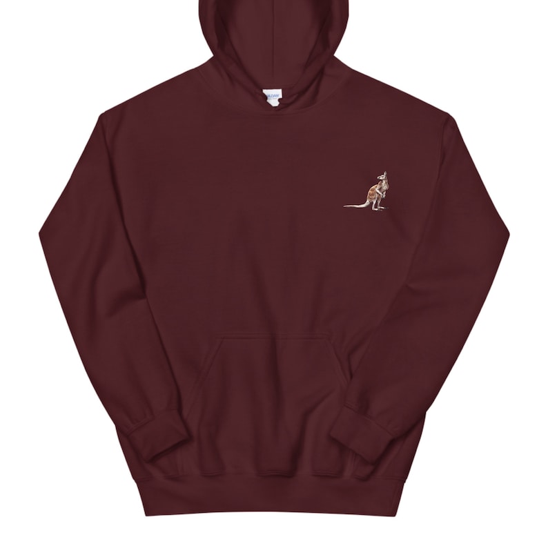 May include: A maroon hoodie featuring an embroidered kangaroo on the left breast. The kangaroo is in brown and tan tones. The hoodie has a drawstring hood and a front pocket.
