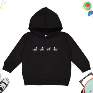 May include: Black hooded sweatshirt with a white graphic of five zebras walking in a line.