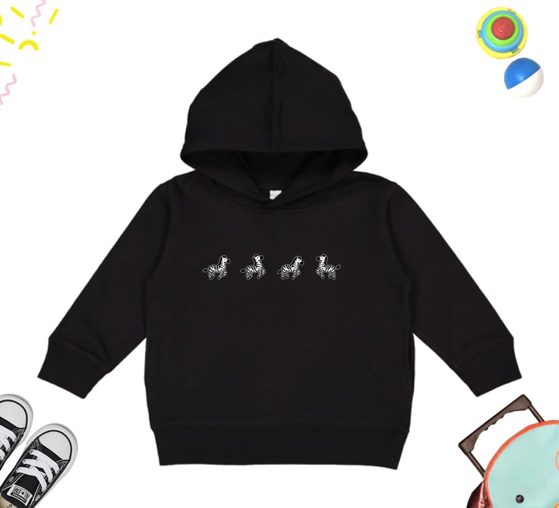 May include: Black hooded sweatshirt with a white graphic of five zebras walking in a line.