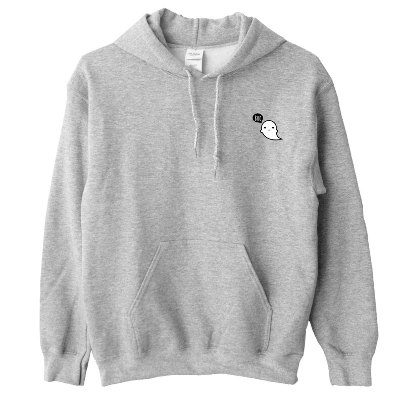 May include: A light gray hooded sweatshirt with a front pocket and drawstring. A small cartoon ghost graphic with the word "BOO" in a speech bubble is on the upper left chest. The sweatshirt is made of a soft material.