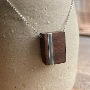 Walnut and silver pendant