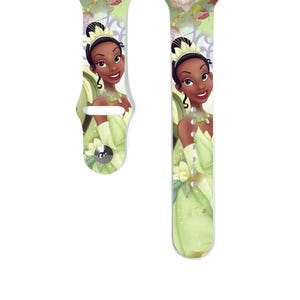 May include: A white Apple Watch band with a green and white design featuring Princess Tiana from Disney's The Princess and the Frog.
