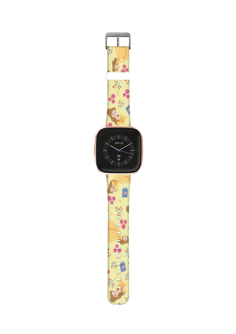 K&ouml;nnte beinhalten: Ein gelbes Armband mit einem Muster von Belle aus Die Sch&ouml;ne und das Biest. Das Zifferblatt der Uhr zeigt das Datum "NOV 28" und die Zeit "96".