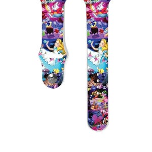 May include: A colourful Apple Watch band with a repeating pattern of Alice in Wonderland characters, including Alice, the Mad Hatter, and the White Rabbit.