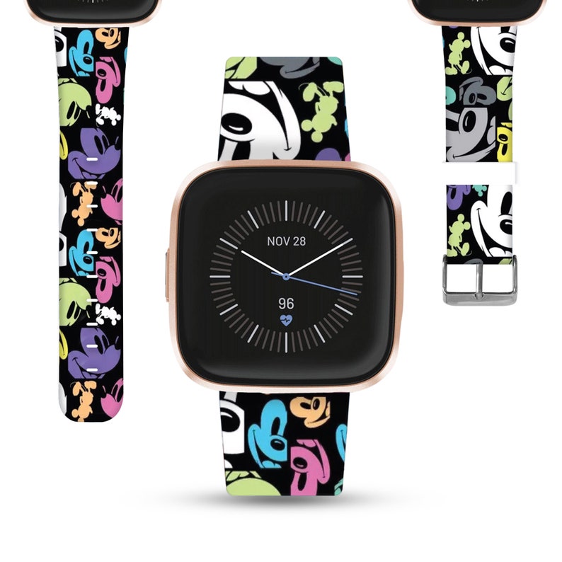May include: A black and white watch band with a colorful Mickey Mouse pattern. The band is shown on a rose gold smartwatch with a black face. The watch face displays the date "NOV 28" and the time "96".