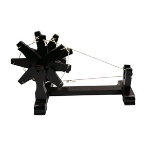 Front centered view, walnut finish Gandhi charkha spinning wheel as a wooden charkha spinning wheel.