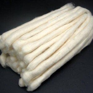 May include: A bundle of white cotton yarn, perfect for crafting projects.
