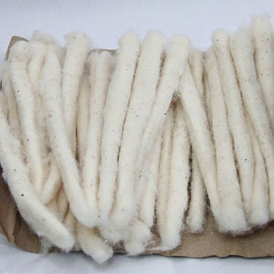 May include: A bundle of white cotton wicks, ideal for use in oil lamps or other wick-based lighting.