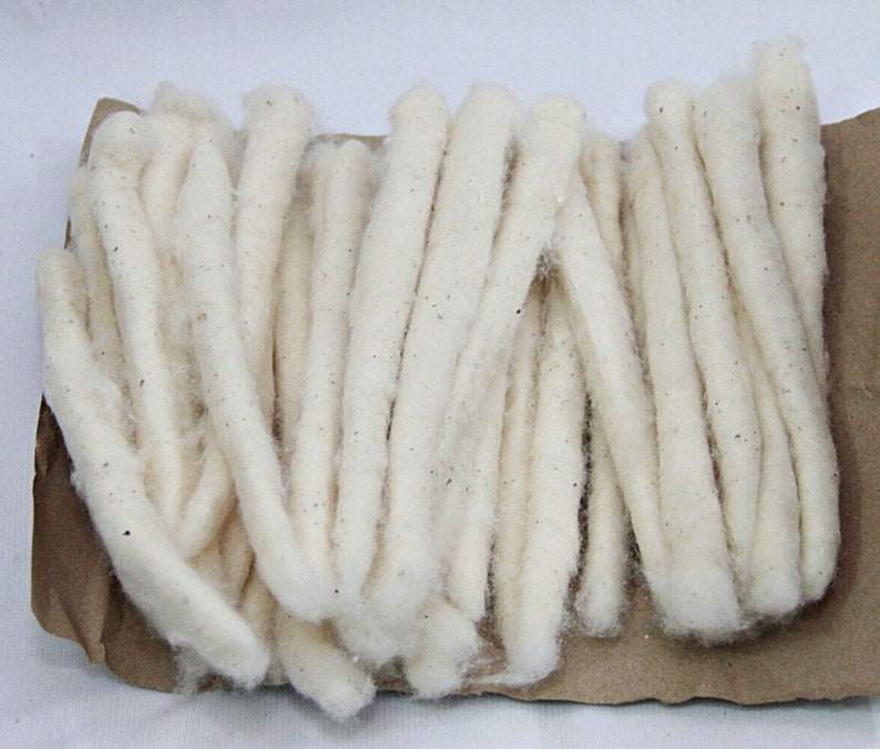 May include: A bundle of white cotton wicks, ideal for use in oil lamps or other wick-based lighting.