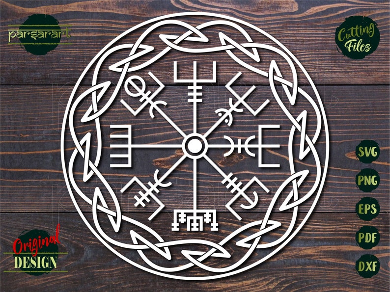 May include: A white, circular design with a compass rose in the center and a Celtic knot border. The compass rose features eight points with various symbols, including a cross, a triangle, and a circle. The design is on a wooden background.