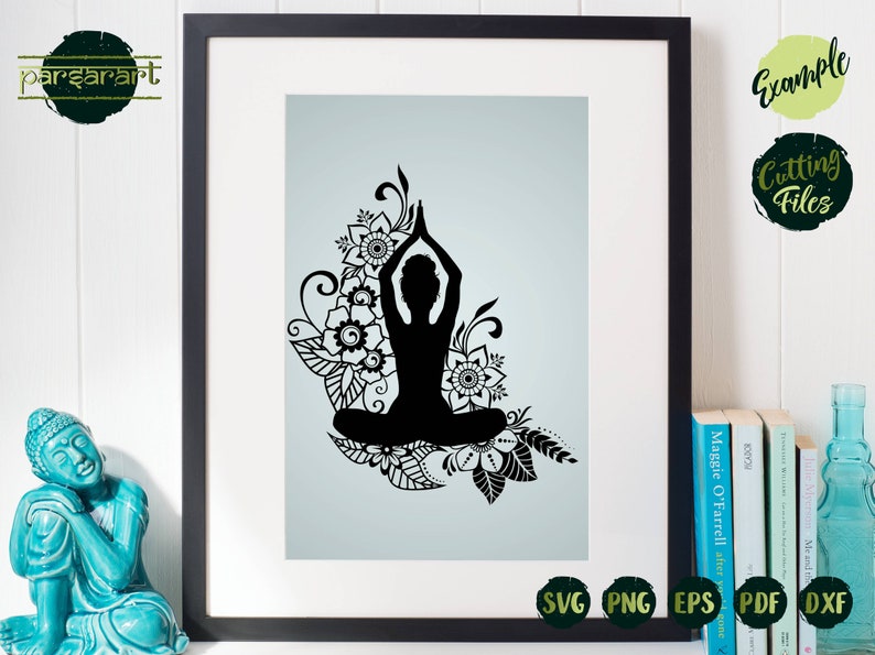 May include: Black silhouette of a person in a yoga pose with floral designs around them. The image is on a light blue background.