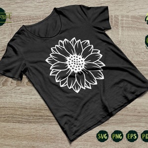 May include: A black t-shirt with a white outline of a sunflower on the front. The shirt is on a wooden surface. The text "Example Cutting Files" is in the upper right corner of the image. The text "SVG PNG EPS PDF DXF" is in the lower right corner of the image.