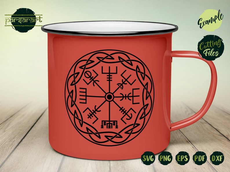 May include: A red enamel mug with a black and white design of a Viking compass with a knotwork border. The mug has a white rim and handle. The text "SVG PNG EPS PDF DXF" is printed below the mug.