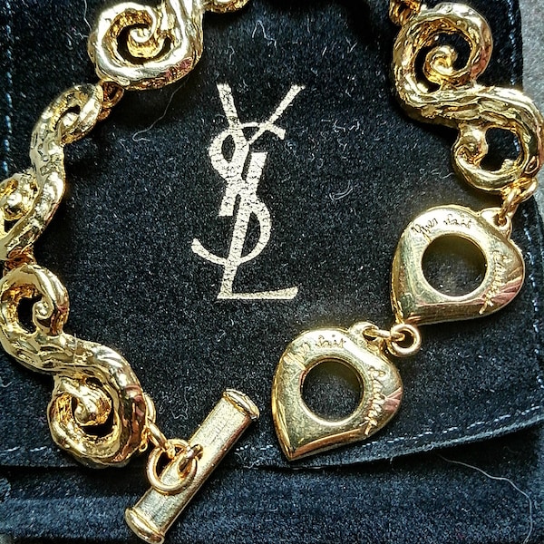Pulsera vintage de corazón de metal dorado de Yves Saint Laurent YSL