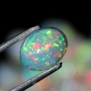 AAA++ Qualità Etiope Opal Wholesale Lot Multi Flashy Fire Opal MM Size Cabochon Gemstone. Per fare anello e gioielli Opale.