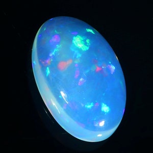 Natural Blue Flashy Dot fire Cabochon, 10.90 Crt. Forma ovale, 22x13x6 mm. Loose gemstone Blue Fire October Birthstone Jewelry Making.
