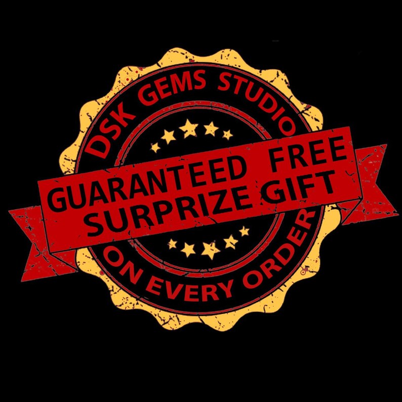 May include: A yellow and red distressed circular stamp with the text "DSK GEMS STUDIO" and "GUARANTEED FREE SURPRISE GIFT ON EVERY ORDER".