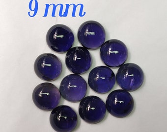 May include: Twelve round, dark purple gemstones, each measuring 9 mm in diameter.