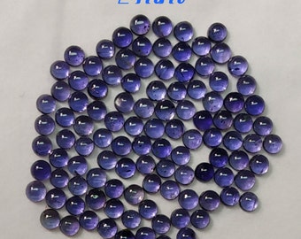 May include: A group of approximately 100 round, 2 mm, purple amethyst cabochons.