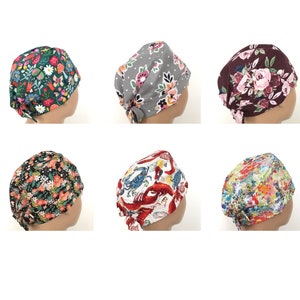 May include: Six different patterned surgical caps, each with a different design. The caps are tied at the back of the head. The designs include floral patterns, a lobster and crab pattern, and a colorful abstract pattern.