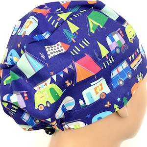 May include: Blue scrub hat with a colorful camping themed print featuring tents, camper vans, trees, and stars.