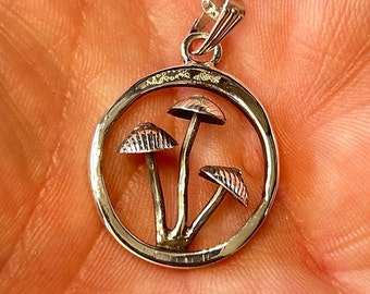 Magic Mushrooms in a pendant. Silver, recycled.